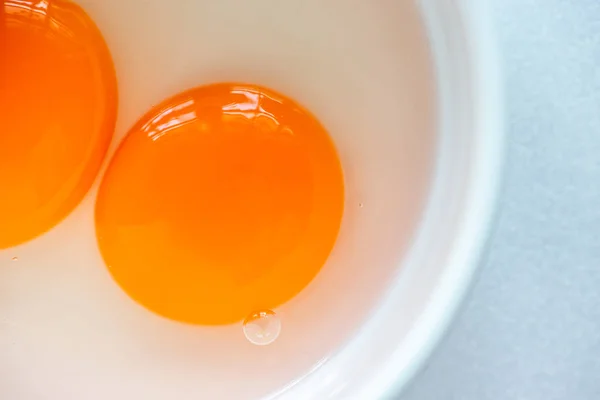 Close Two Raw Egg Yolks White Bowl — Stock Photo, Image
