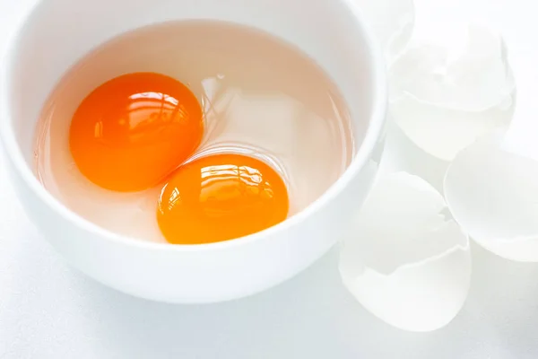 Two Raw Egg Yolks White Bowl Broken White Egg Shell — Stock Photo, Image