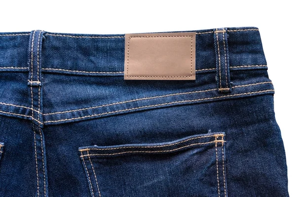 Rückseite Blaue Jeans Mit Lederjeans Etikett Das Auf Eine Blaue — Stockfoto