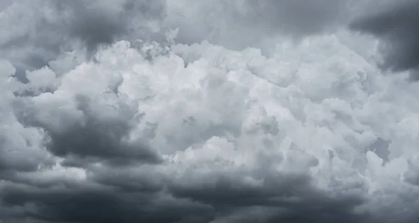 Dark storm clouds before rain used for climate background. Clouds become dark gray before raining. Abstract dramatic background.