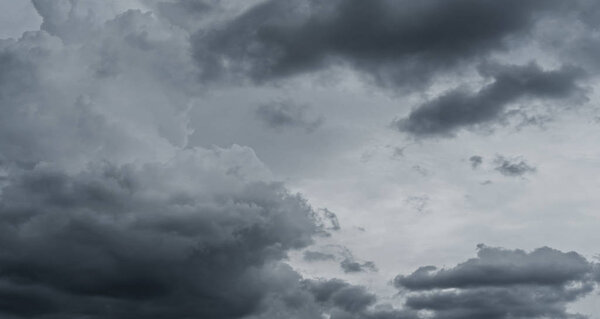 Dark storm clouds before rain used for climate background. Clouds become dark gray before raining. Abstract dramatic background.