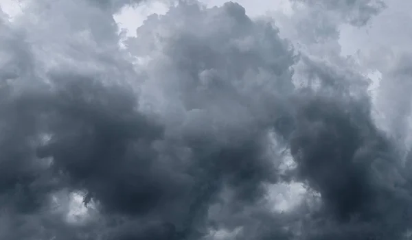 Dark storm clouds before rain used for climate background. Clouds become dark gray before raining. Abstract dramatic background.