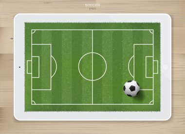 Futbol sahası bölgesinde futbol topu ahşap desenli tablet sergileniyor. Futbol maçı ve futbol taktiği fikri yaratmak için. Vektör illüstrasyonu.