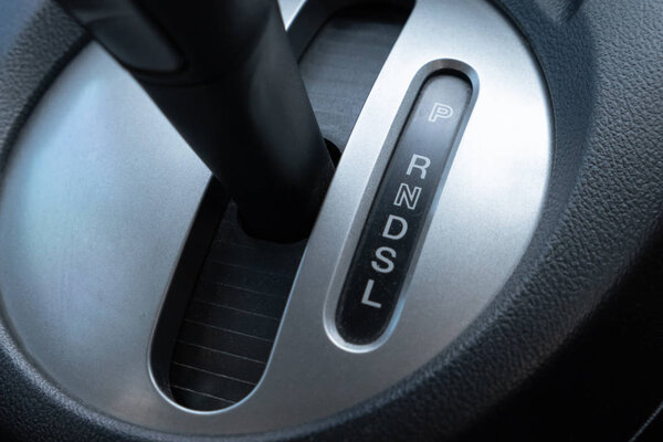 Car gearbox lever inside driver place.