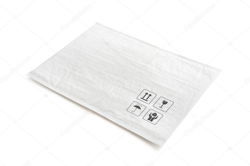 White postal package. Plastic parcel with fragile care sign and symbol. Object isolated on white background with clipping path.