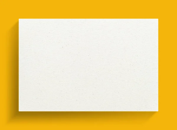 白色帆布框架在黄色背景与软阴影 — 图库照片