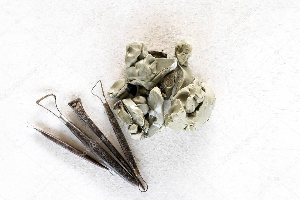 Sculpture tools set background. Art and craft tools on a white b