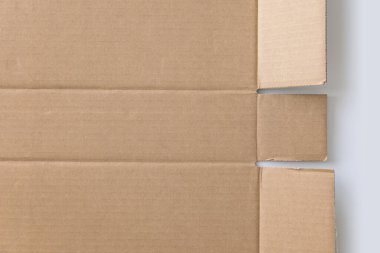 Kahverengi karton yaprak dokusu arka planı. Geri dönüşüm kağıt kutusunun dokusu arkaplan için eski vintage deseni ile.