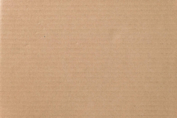 Коричневый картонный лист текстуры фона. Текстура рециркуляционной бумажной коробки в старинном стиле для фона.