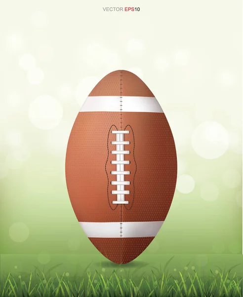 緑の芝生のフィールド上のアメリカンフットボールボール光ぼんやりボケの背景 ベクターイラスト — ストックベクタ