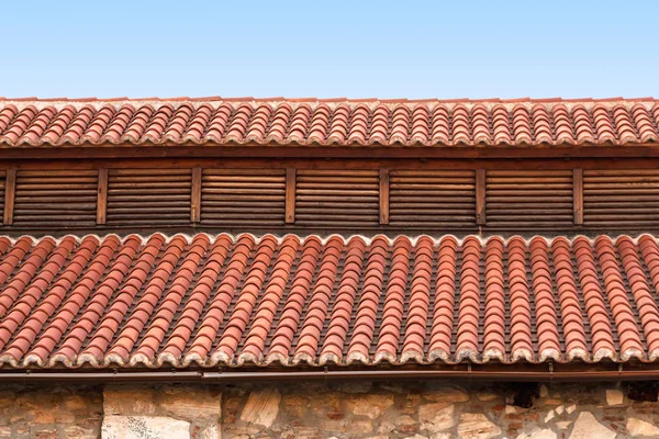 Red tile rooftop, closeup background.