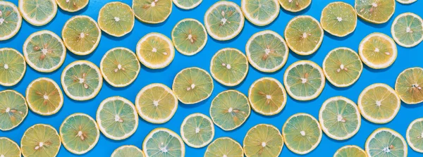 Lemon Slices Lines Hard Shadows Blue Background Flat Lay Image — Stock Photo, Image