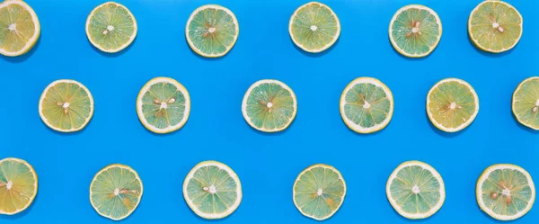 Lemon Slices Lines Hard Shadows Blue Background Flat Lay Image — Stock Photo, Image