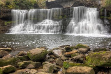Chagrin Falls. The beautiful 20-foot tall waterfall is right in the middle of the small town along Main street. Chagrin Falls is a village in Cuyahoga County, Ohio, United States and is a suburb of Cleveland in Northeast Ohio's Cleveland-Akron-Canton clipart