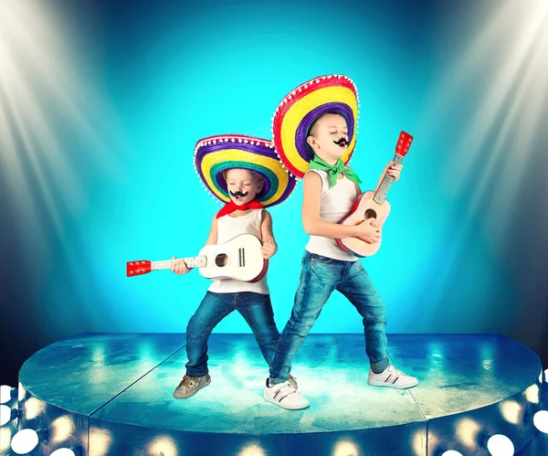 Mexican party. Two brothers in sombreros perform on stage, sing serenades.
