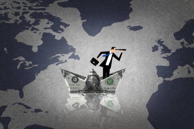Adamın bir dolar ile yapılan bir tekne içinde