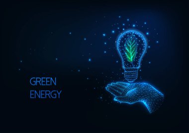 Geleceğin yeşil, yenilenebilir enerji kavramı. Parlayan düşük çokgen el ampulü.