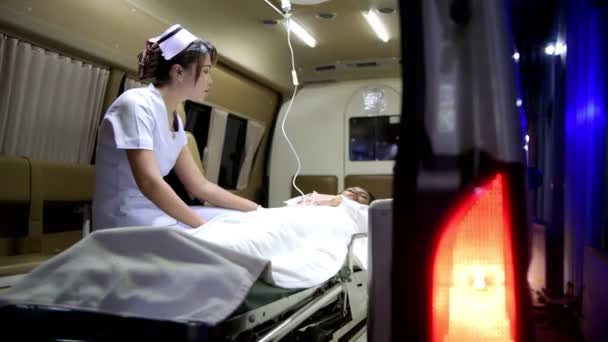 Accident Victim Ambulance Night Being Treated Nurse Chinese Young Female — Stock Video