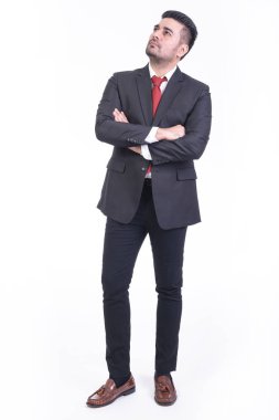 Beyaz arka planda izole iş adamı. Ararken yakışıklı genç Hintli işadamı takım elbise portre. Tam uzunlukta vurdu.