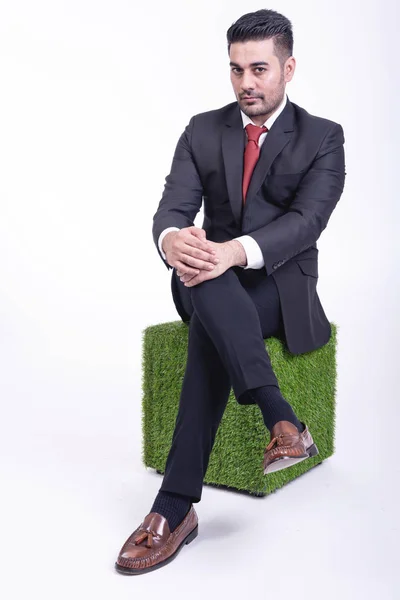 Businessman Sitting Green Chair Isolated Handsome Young Indian Businessman Suit — Stock Photo, Image