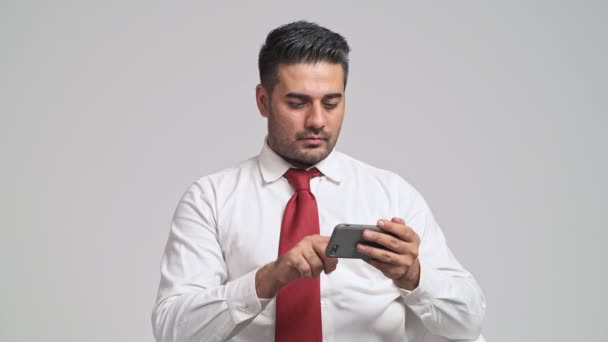 Attentive Young Man Using Smartphone Becoming Disappointed — Stock Video