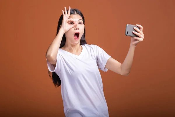 Woman Playing Mobile Game Isolated Orange Background Young Asian Woman — Stock Photo, Image