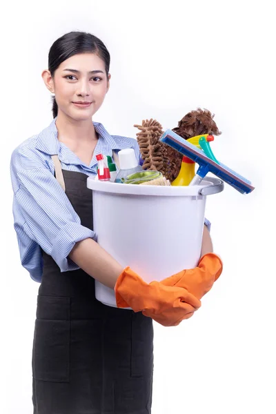 House cleaning service woman isolated in white. Asian young woman with gloves, happy smile, holding bucket full of cleaning items. House cleaning service concept.