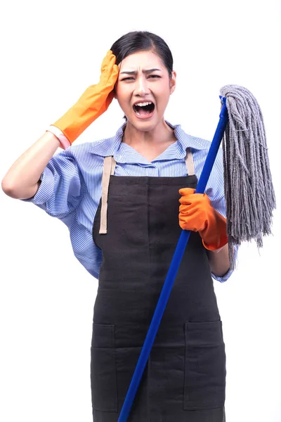 House cleaning service woman isolated in white. Asian young woman with gloves, angry mood, holding a mop. House cleaning service concept.