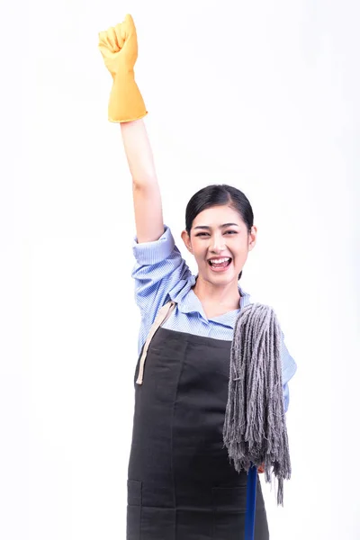 House cleaning service woman isolated in white. Asian young woman with gloves, happy smile, holding a mop, Winning pose. House cleaning service concept.