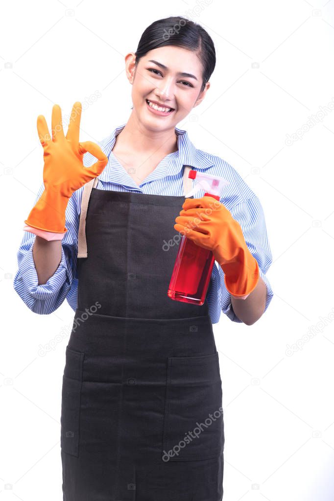 House cleaning service woman isolated in white. Asian young woman with gloves, happy smile, okay sign pose. House cleaning service concept.