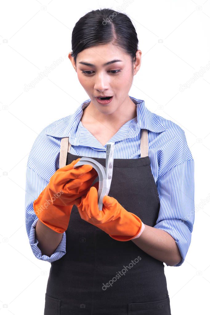 House cleaning service woman isolated in white. Asian young woman with gloves, very happy smile, Counting cash. House cleaning service concept.
