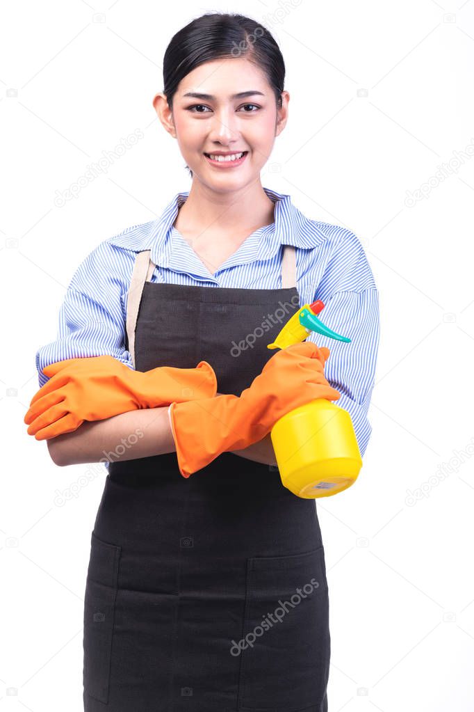 House cleaning service woman isolated in white. Asian young woman with gloves, happy smile, holding yellow spray. House cleaning service concept.