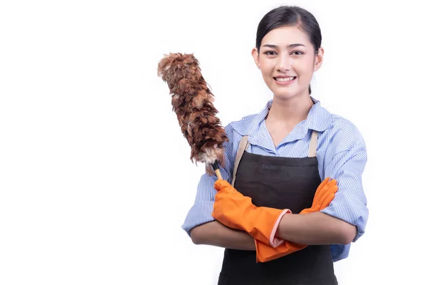 House cleaning service woman isolated in white. Asian young woman with gloves, happy smile, holding duster. House cleaning service concept.