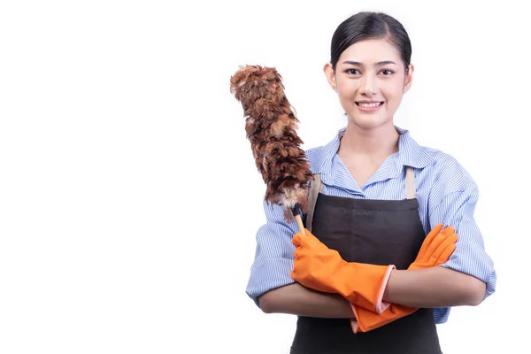 House cleaning service woman isolated in white. Asian young woman with gloves, happy smile, holding duster. House cleaning service concept.