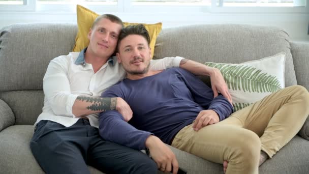 Caucasian Gay Couple Lying Sofa Home Watching — Stock Video