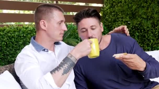 Caucasian Gay Couple Sitting Garden Have Breakfast — Stock Video