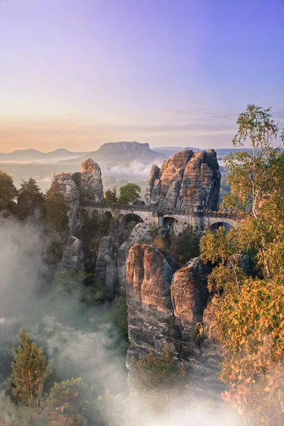 Sunrise at the Bastei bridge above the Elbe River in the Elbe Sandstone Mountains of Germany. One of the most spectacular hiking regions in Europe. The bizarre, primeval landscape of the Saxon Switzerland simply overwhelms visitors.