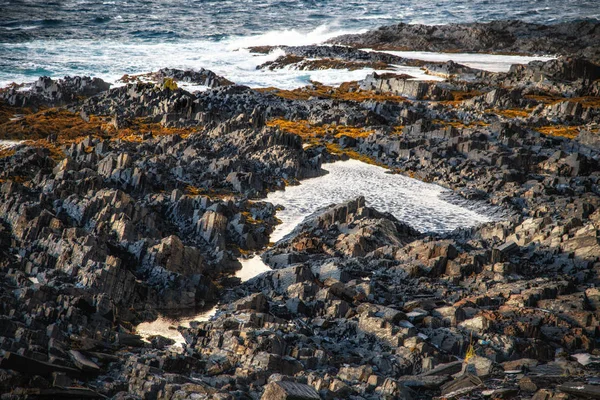 Pixel-like sharp stones on the beach of Barets Sea
