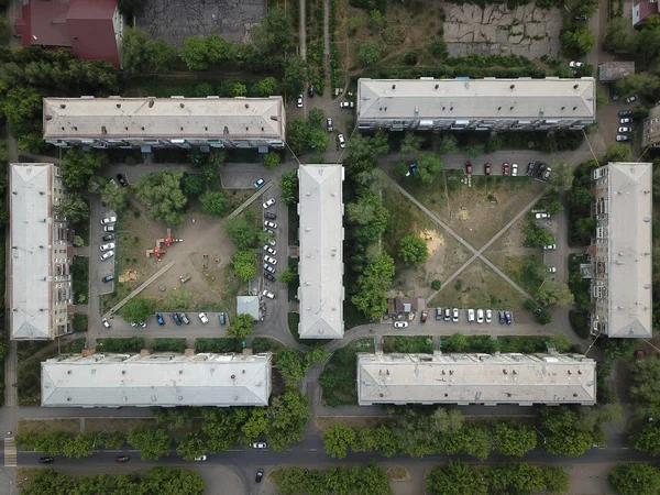 Aerial drone top down shot of downtown with houses and square courtyards. Magnitogorsk, Russia
