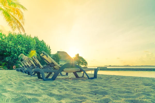 Beach chairs in Maldives island at the sunrise time . ( Filtered — Stock Photo, Image