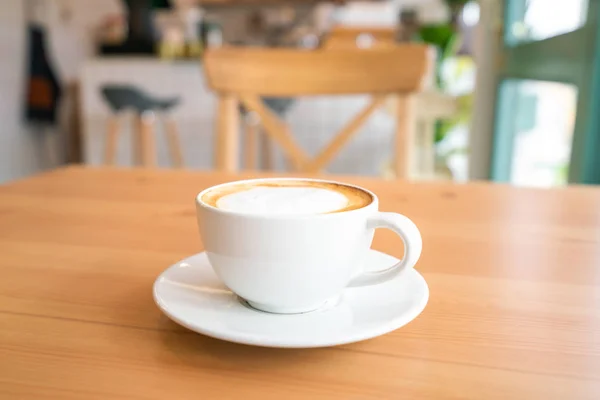 Hot coffee on wooden table — Stock Photo, Image