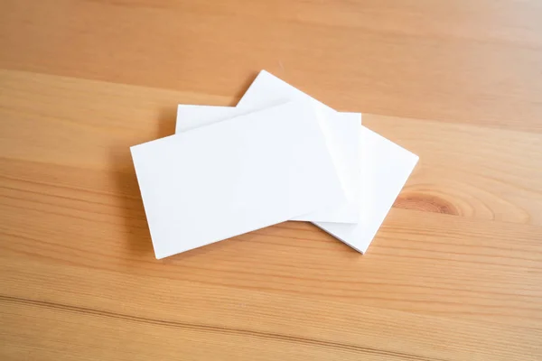 Blank business cards on wooden surface — Stock Photo, Image