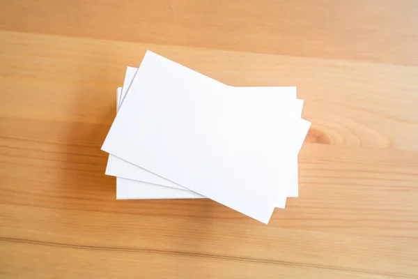 Blank business cards on wooden surface — Stock Photo, Image