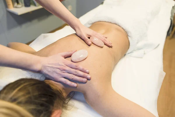 Massages with hot stones in a beauty center