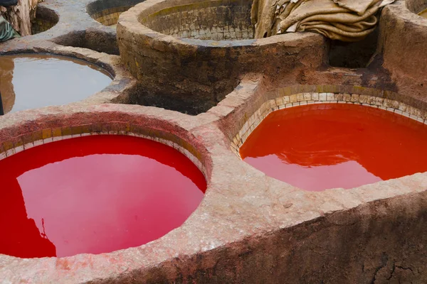 Painting the leather in Fez, the ancient tanneries in the heart of medina