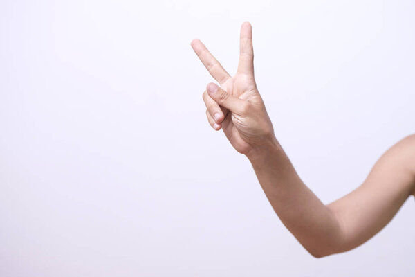 Closeup of persons hand showing gesture over white background