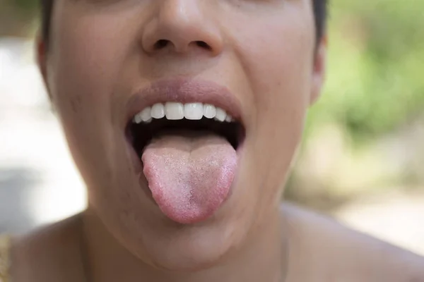 Close view of woman with wide opened mouth