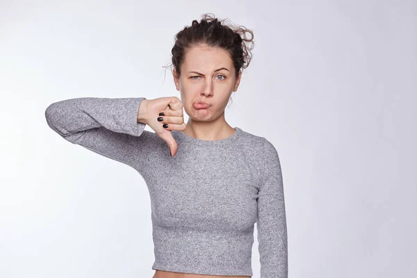 Discontent Attractive European Woman Shows Disapproval Sign Keeps Thumb Expresses — ストック写真