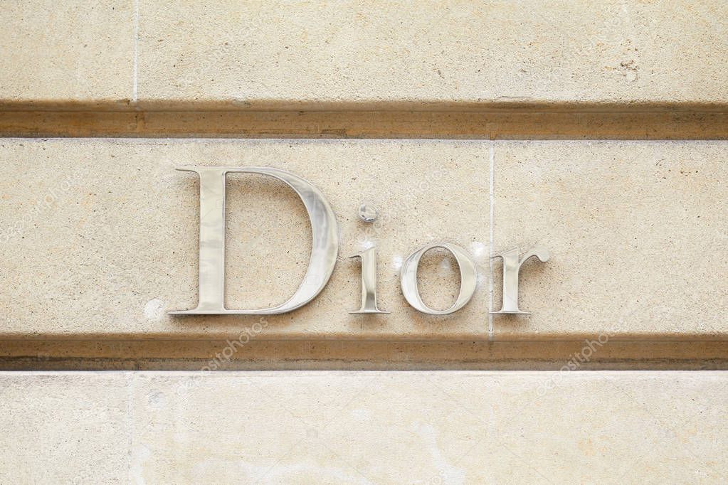 PARIS, FRANCE - JULY 22, 2017: Dior, fashion luxury, silver sign in avenue Montaigne in Paris, France.