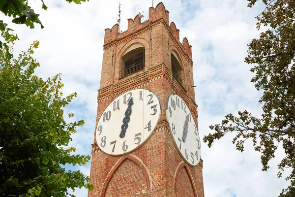 Belvedere ancient clock tower and trees in a summer day in Mondovi, Italy. — Stock Photo, Image